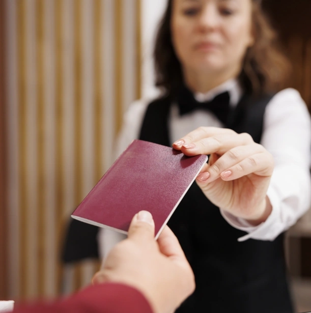 hotel-concierge-checks-passport